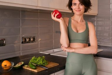 Photo Of Young Woman With Vegetables At The Kitchen.